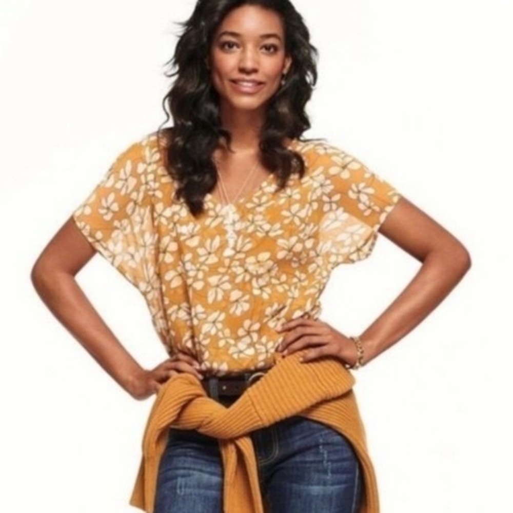 White and yellow floral pattern CAbi blouse. Size small.